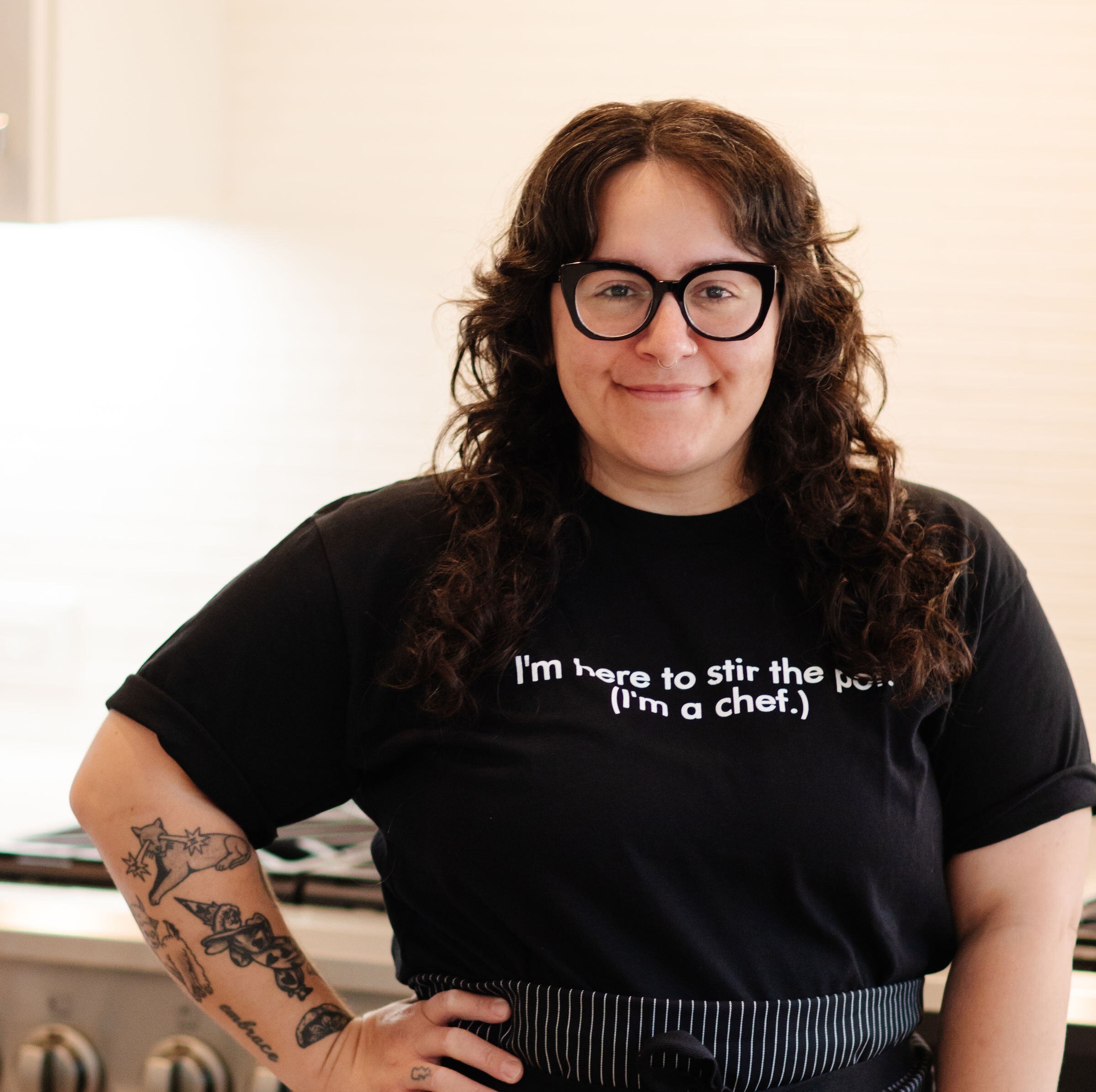 Smiling chef in glasses and a Tiny Spoon Chef T-shirt