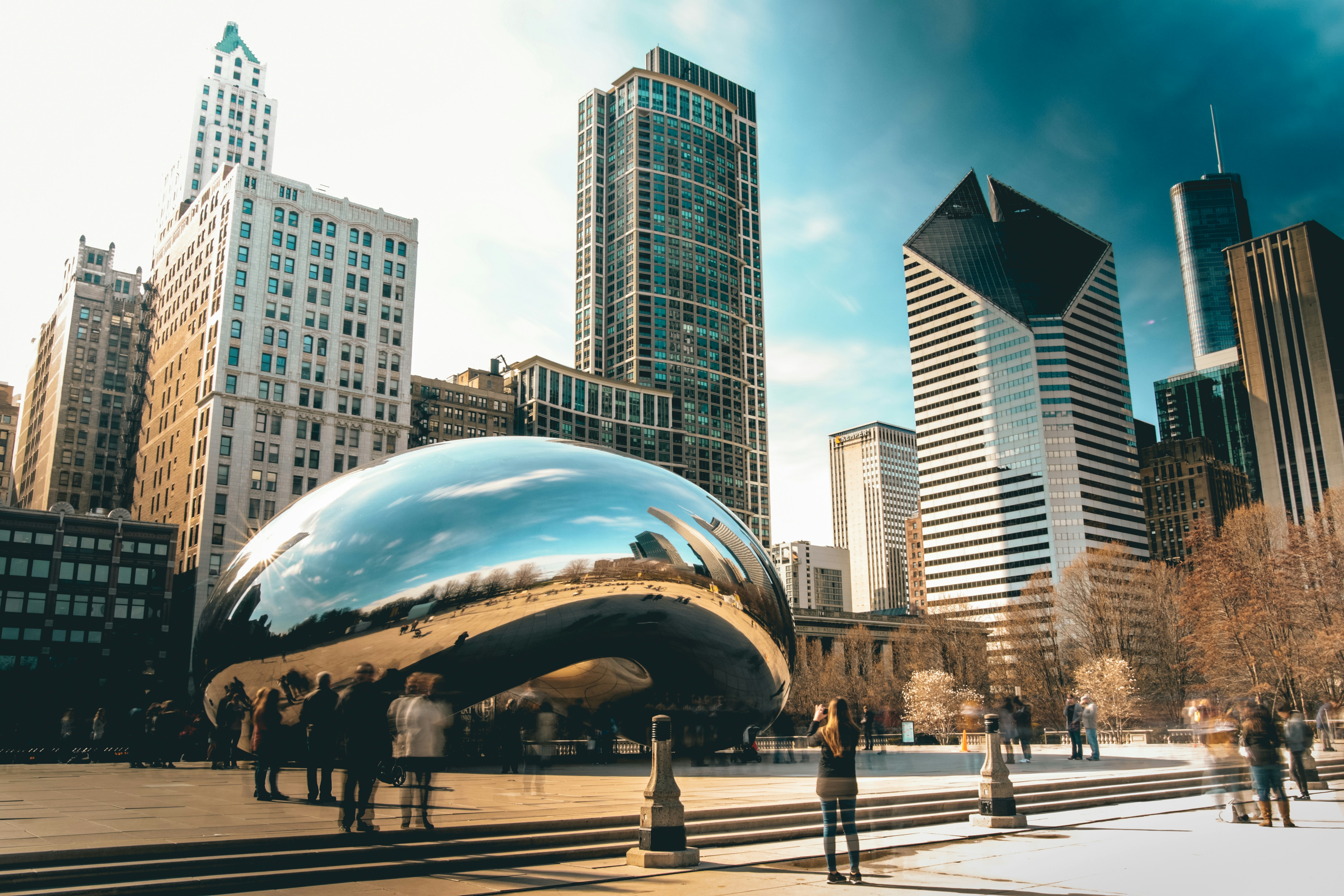 Cloud Gate in Chicago's Millennium Park with downtown skyscrapers behind it