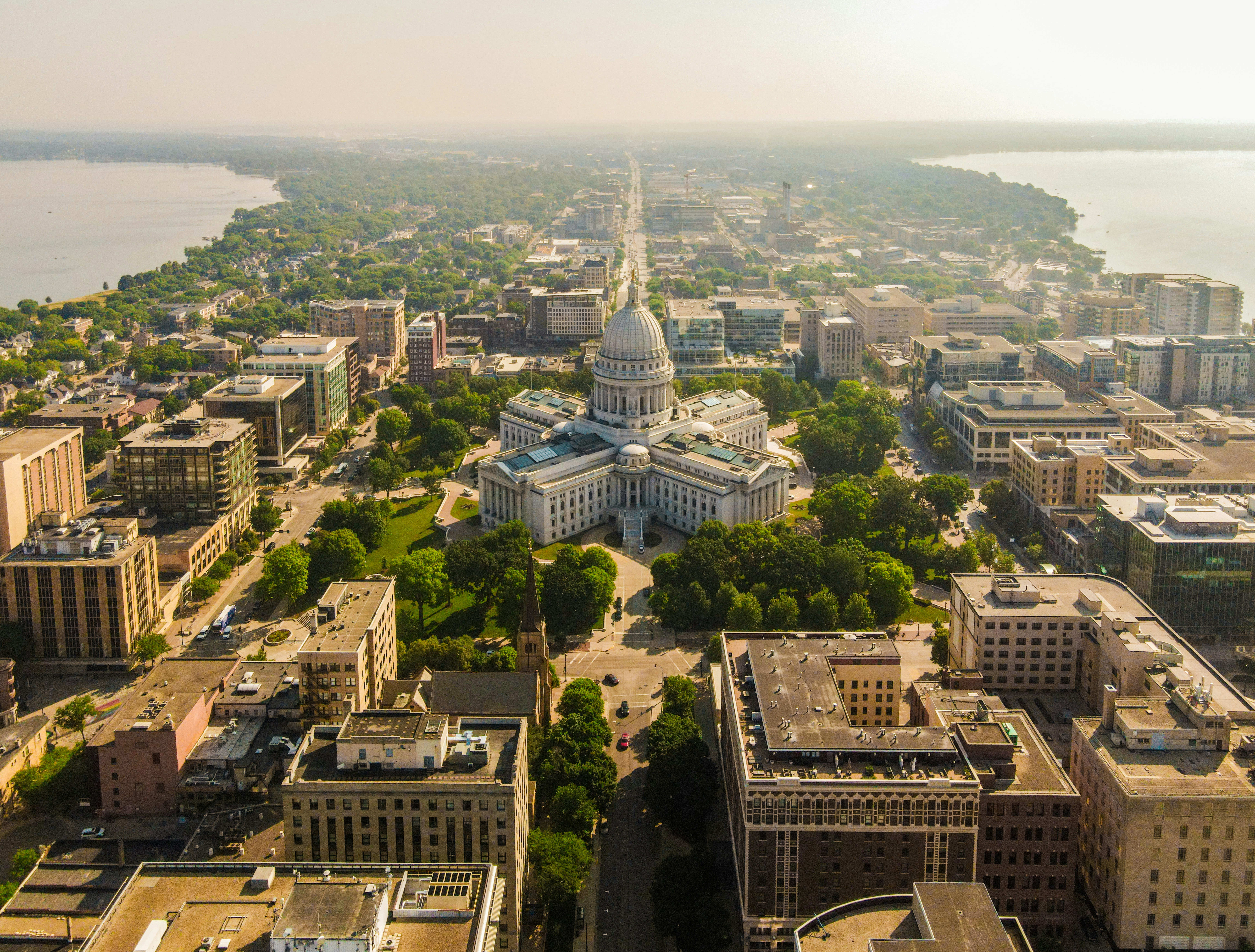 Aerial view of Madison's isthmus and the Wisconsin State Capitol between two lakes