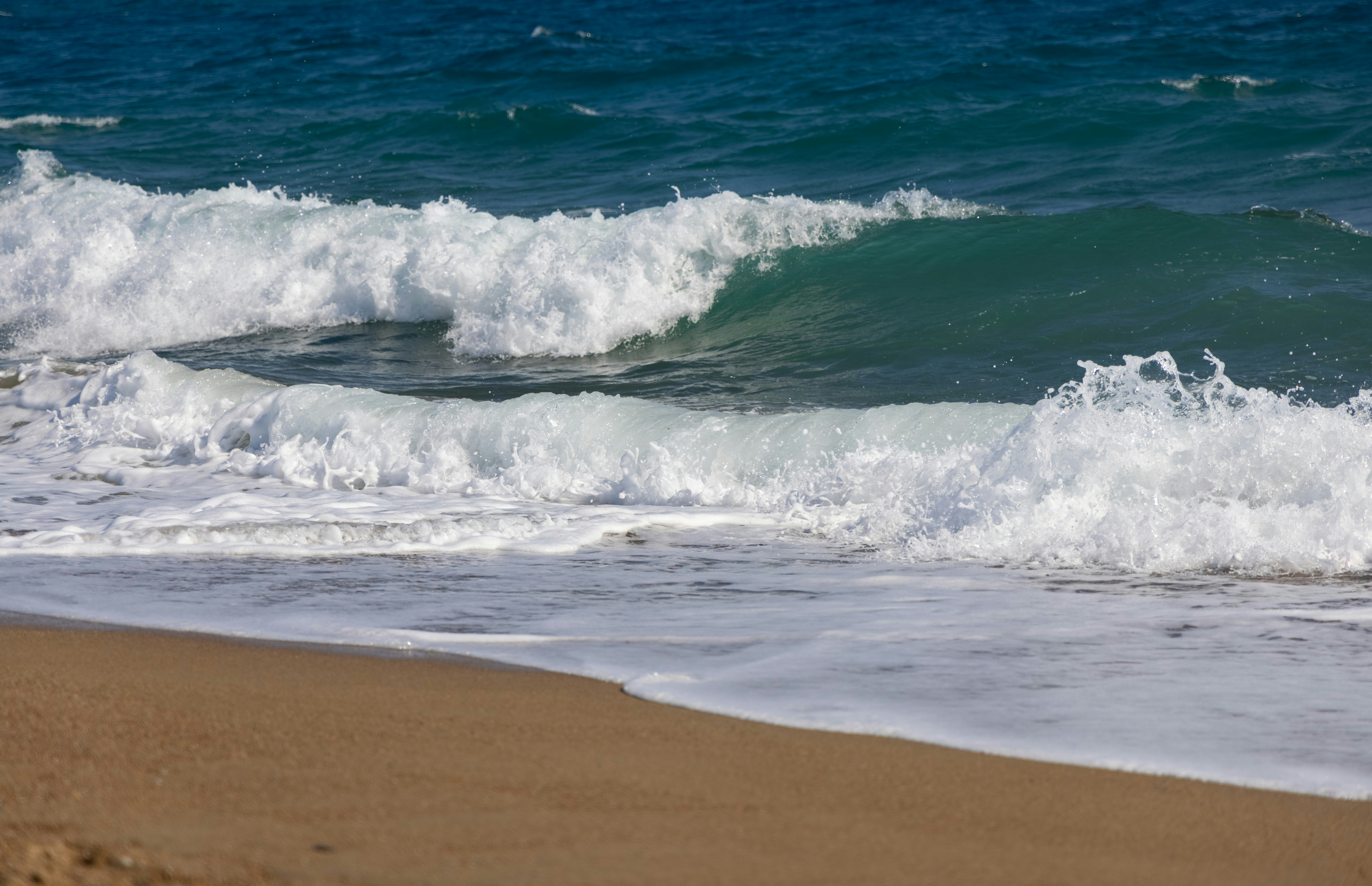 Waves rolling onto a sandy beach